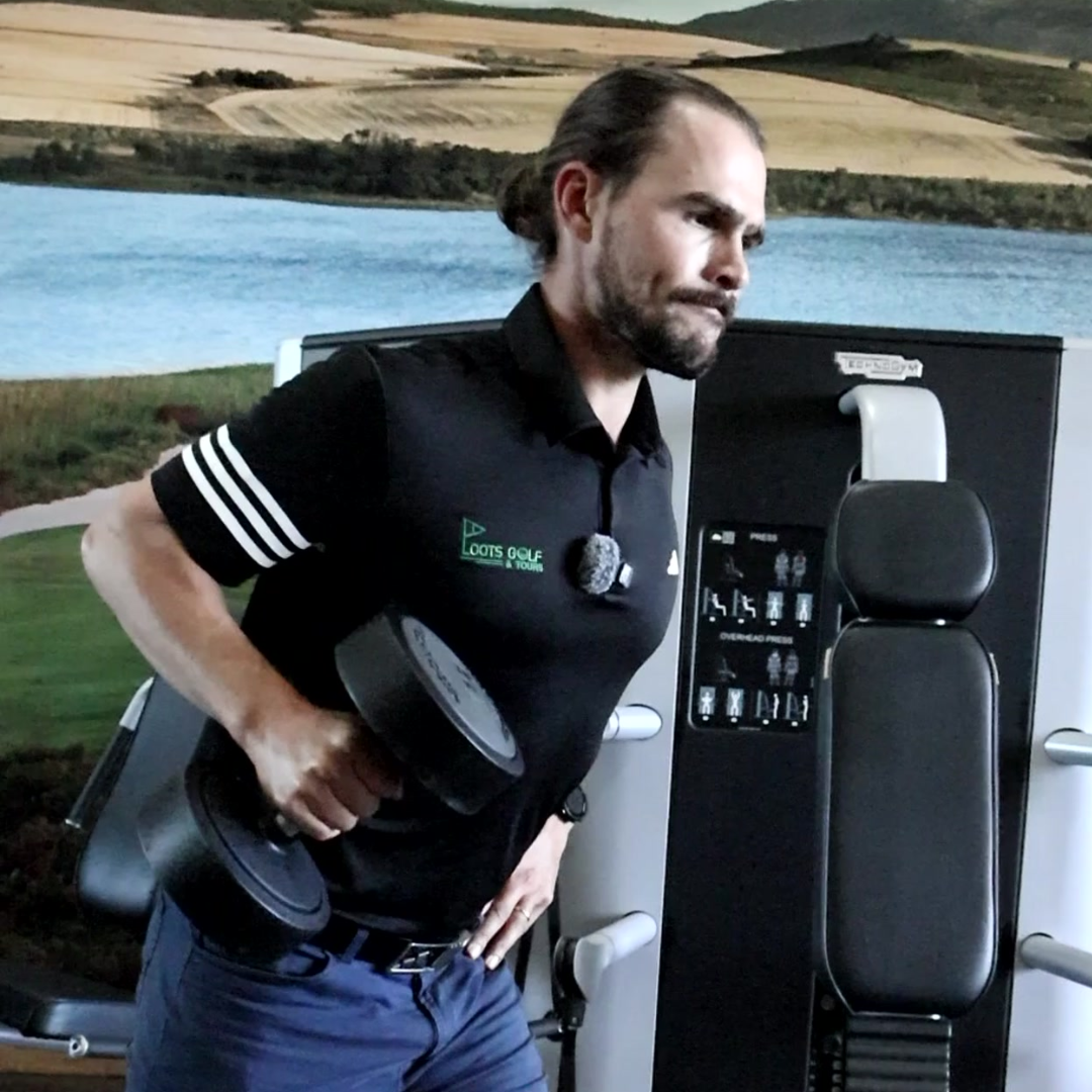 Man in a black shirt with white stripes standing next to a vehicle with a scenic background